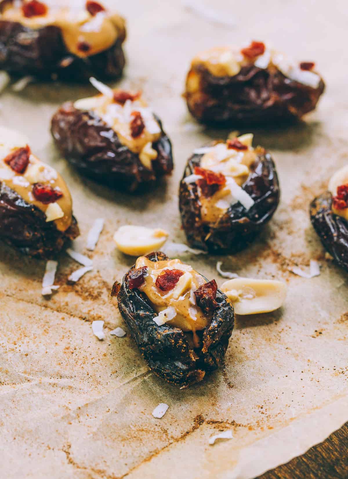 Dried dates stuffed with cinnamon peanut butter, topped with shredded cocunut & chopped cranberries