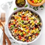 Mexican Brown Rice Salad in bowl and ingredients needed to make salad