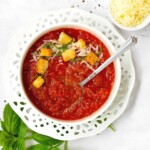 fresh tomato basil soup in a bowl with croutons and cheese