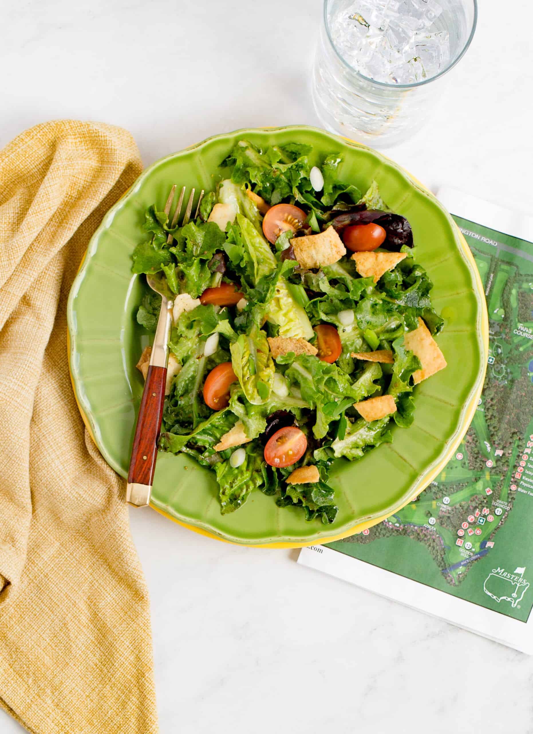 Famous green jacket salad on a plate with map of maters near