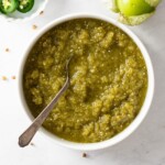 fermented salsa in bowl with jalapeños and tomatillos by it
