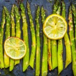 cooked asparagus with lemo wedges