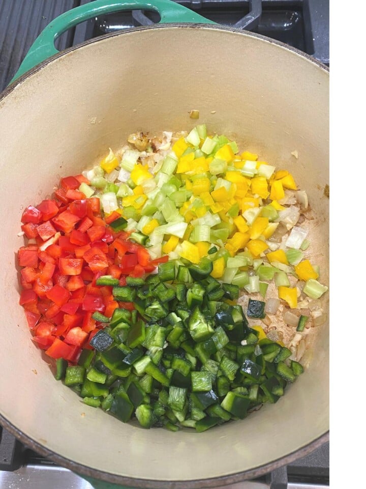peppers, celery added to cooking pan