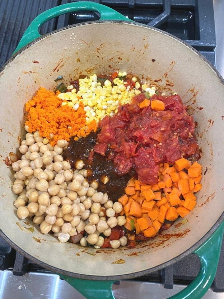 fresh corn, tomatoes, chickpeas and carrots added to pan with bullion base and veggies