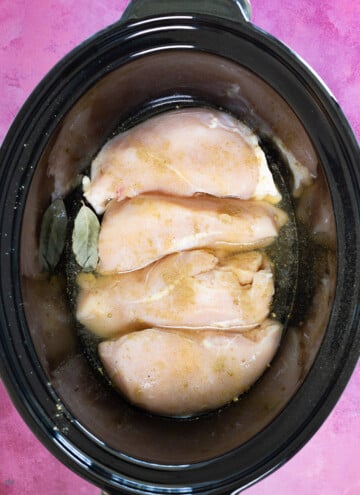 chicken breast, seasoning and broth in slow cooker