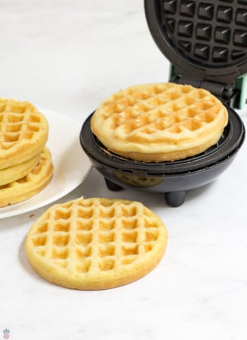 wonder bread chaffle on a Dash and a stack of them next to it