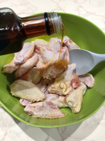 raw wings with sesame oil drizzled on