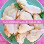raw cut chicken wings on a large plate