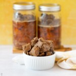 roast beef in canning jars and bowl of canned beef cubes
