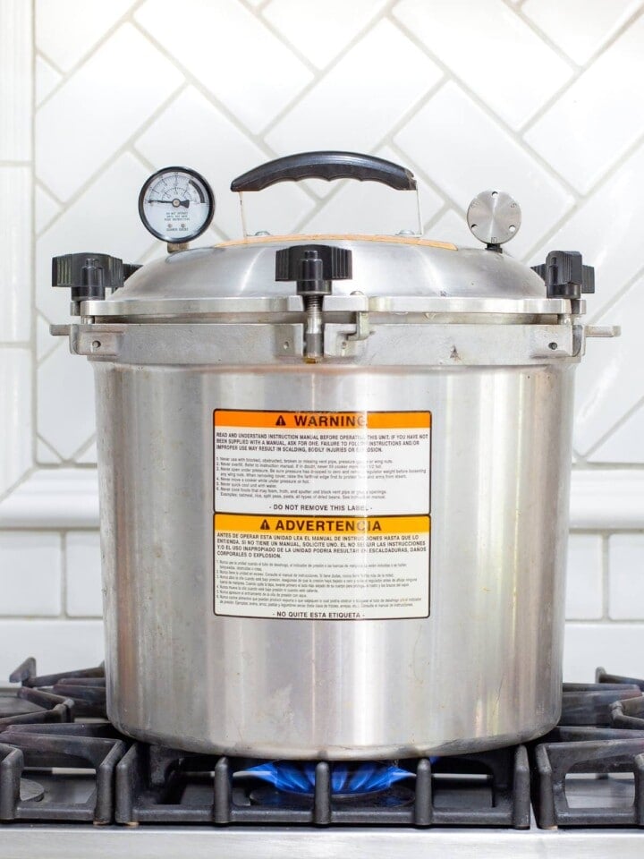 My American standard pressure cooker sitting on my stove with the lid on and the pressure gauges zero