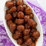 grape jelly and chili sauce cooked with frozen meatballs ready to serve in a bowl.