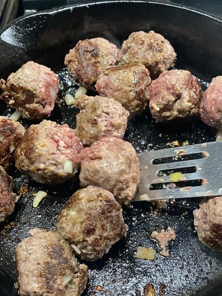 frying in skillet bbq meatballs so they are browned before putting in slow cooker