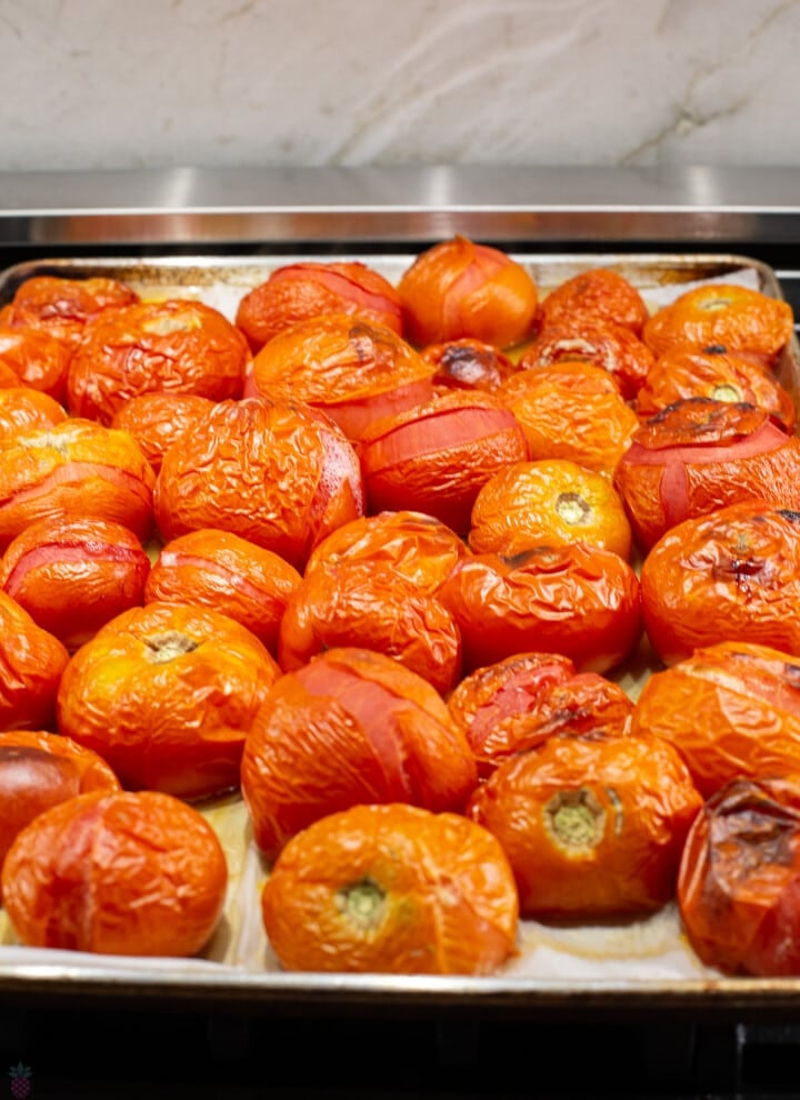 oven baked tomatoes with wrinkled skin peeling off