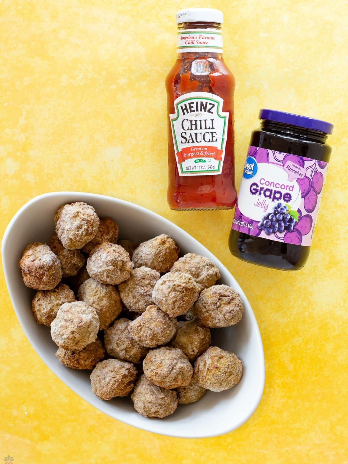Saucy Crockpot Meatballs with Grape Jelly and Chili Sauce Intentional