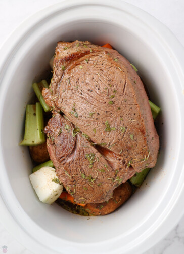 seared Sirloin Tip Roast that in a Slow Cooker With carrots, potatoes, celery, onions, ready to cook