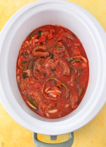 Steak Picado ready to cook in a crock pot