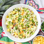 mexican slaw with pieces of pineapple and cilantro mixed in