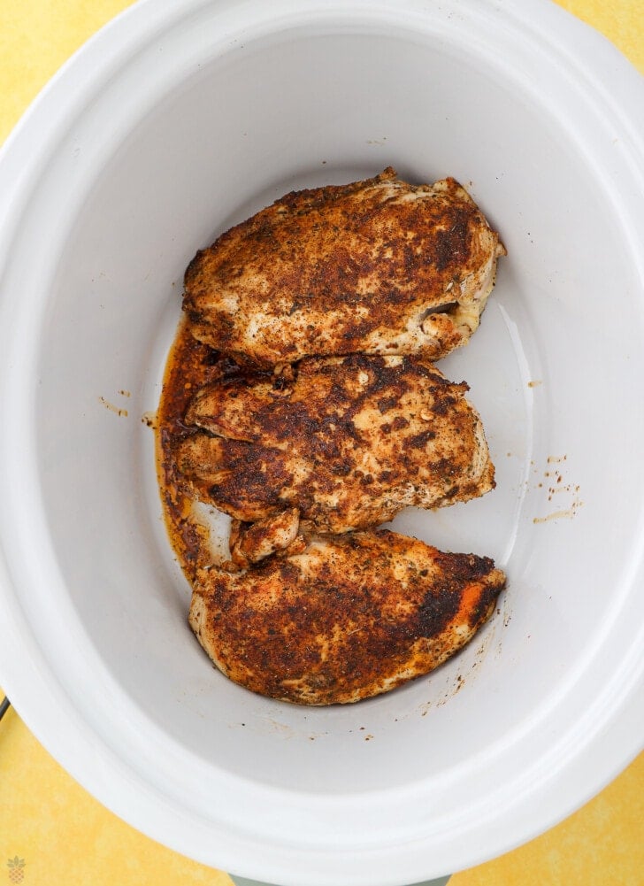 Cajun Chicken in cast iron skillet sauteing chicken