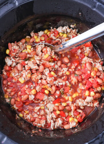 ground turkey chili mixed together in a crock pot ready to cook