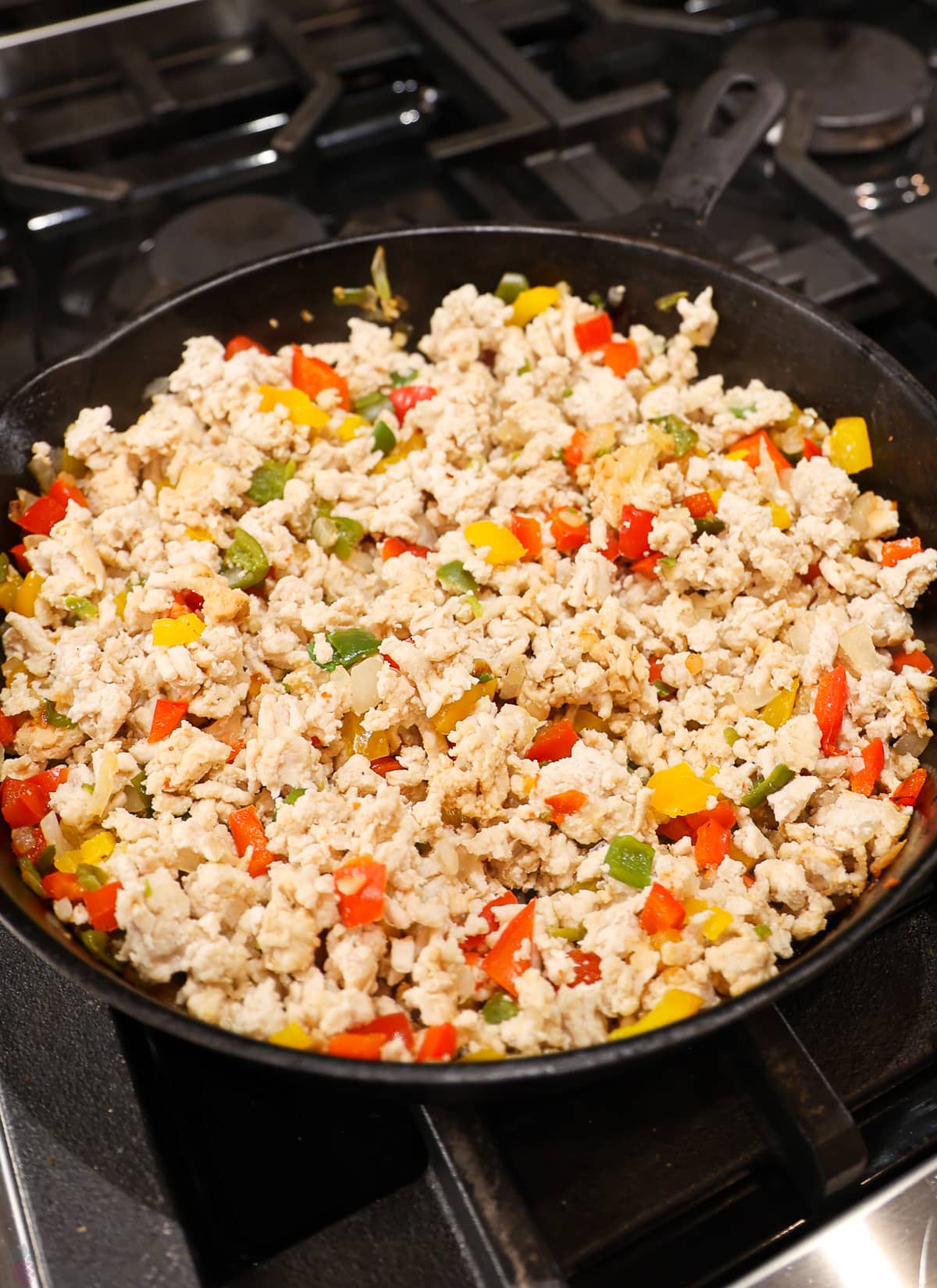 ground turkey and peppers, onions, garlic all cooked together in a skillet