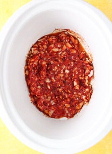 Slow cooker with the seasonings and tomato paste for pulled pork