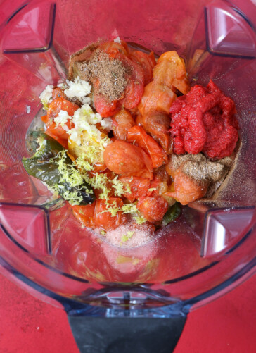 roasted veggies, seasonings and lime in blender for cherry tomato salsa