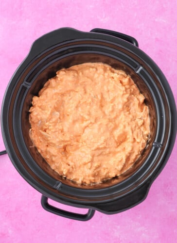 Buffalo crock pot dip in a small crock pot ready to cook