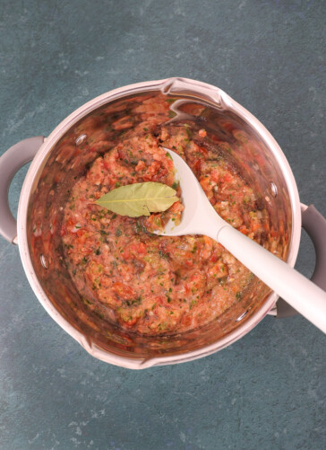 cooking salsa picante and a bay leaf