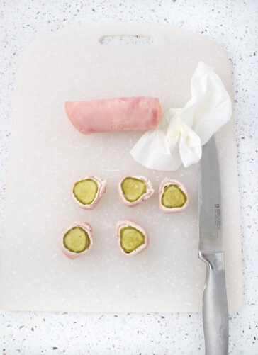 Pickle roll up being cut with a knife