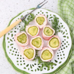 Party pickle Roll-Ups on a plate with fresh dill ready to be served
