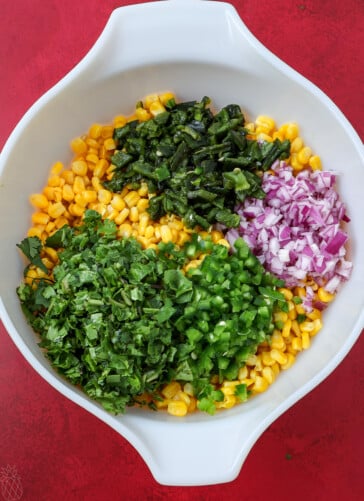 corn, peppers, onions and corn in a bowl