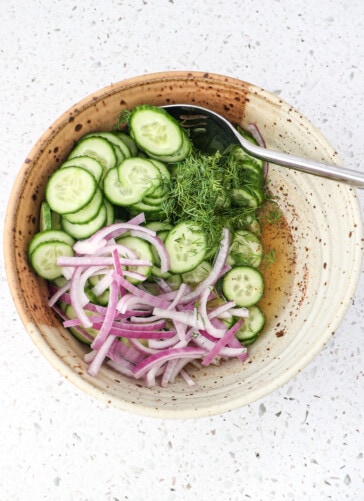 Having cucumbers fresh dill and red onions to the salad dressing made with honey