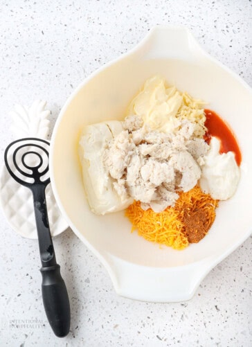 all the ingredients in a bowl to make crab dip