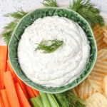 Made with sour cream in a bowl with chips carrot sticks and celery sticks