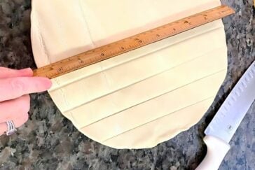 A ruler measuring pie dough