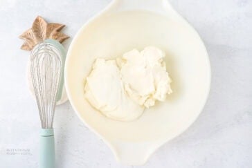 cream cheese and sour cream whisked in a bowl