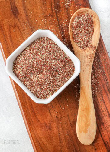 easy dry rub for chicken wings in a bowl and on a wooden spoon