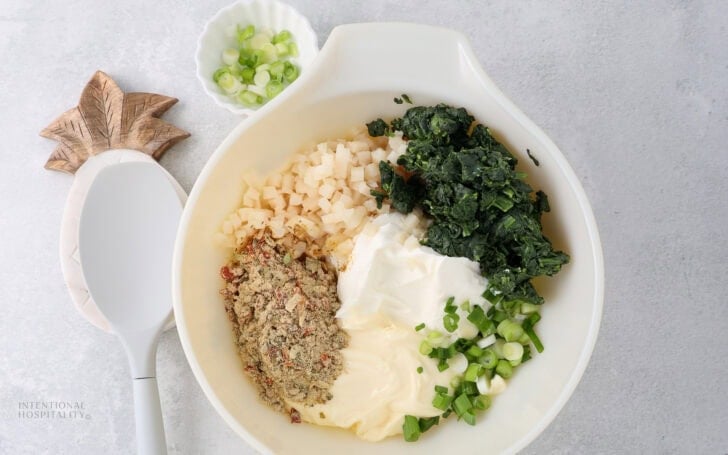 All the ingredients in a bowl to make more vegetable dip