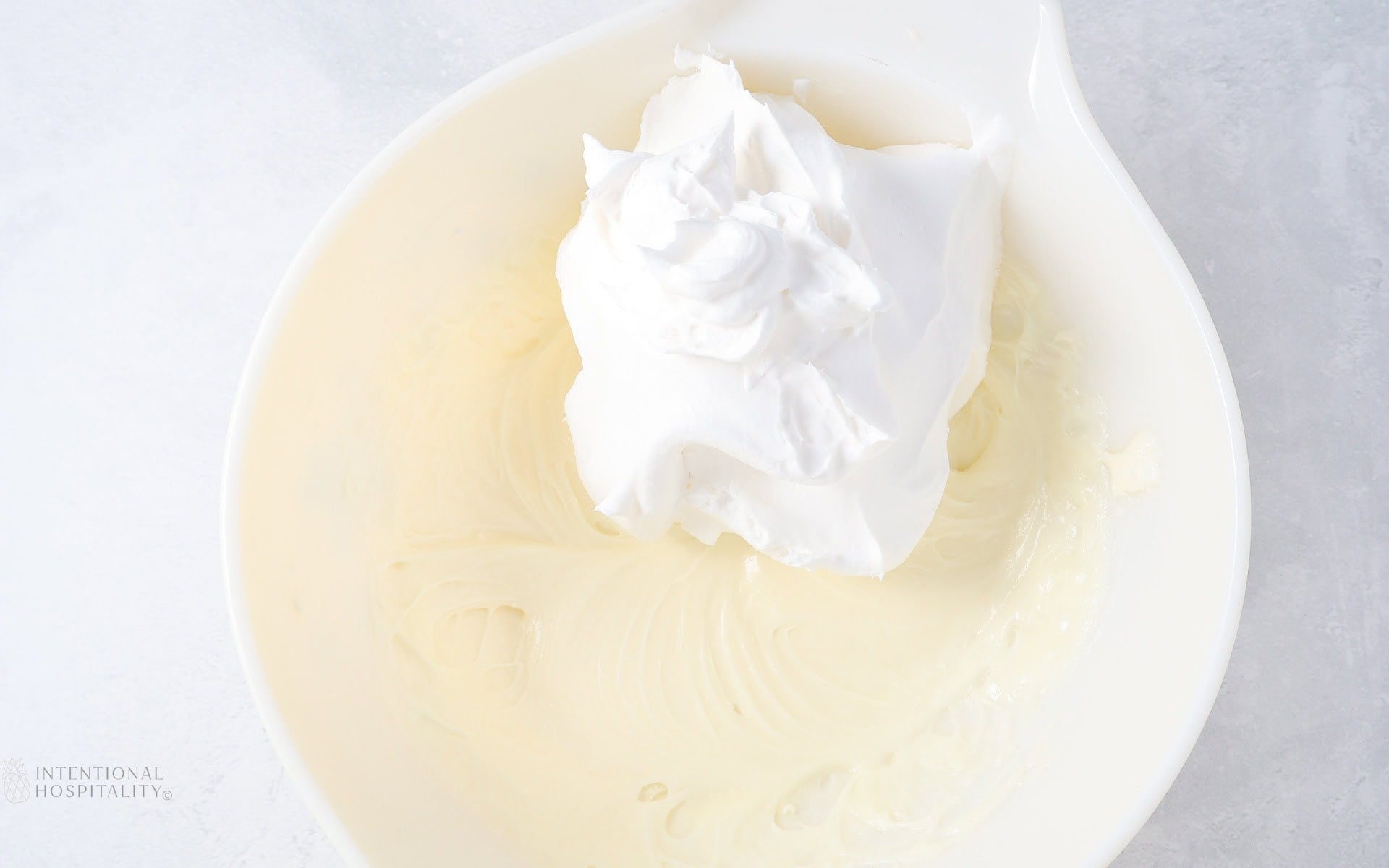 adding cool whip to bowl