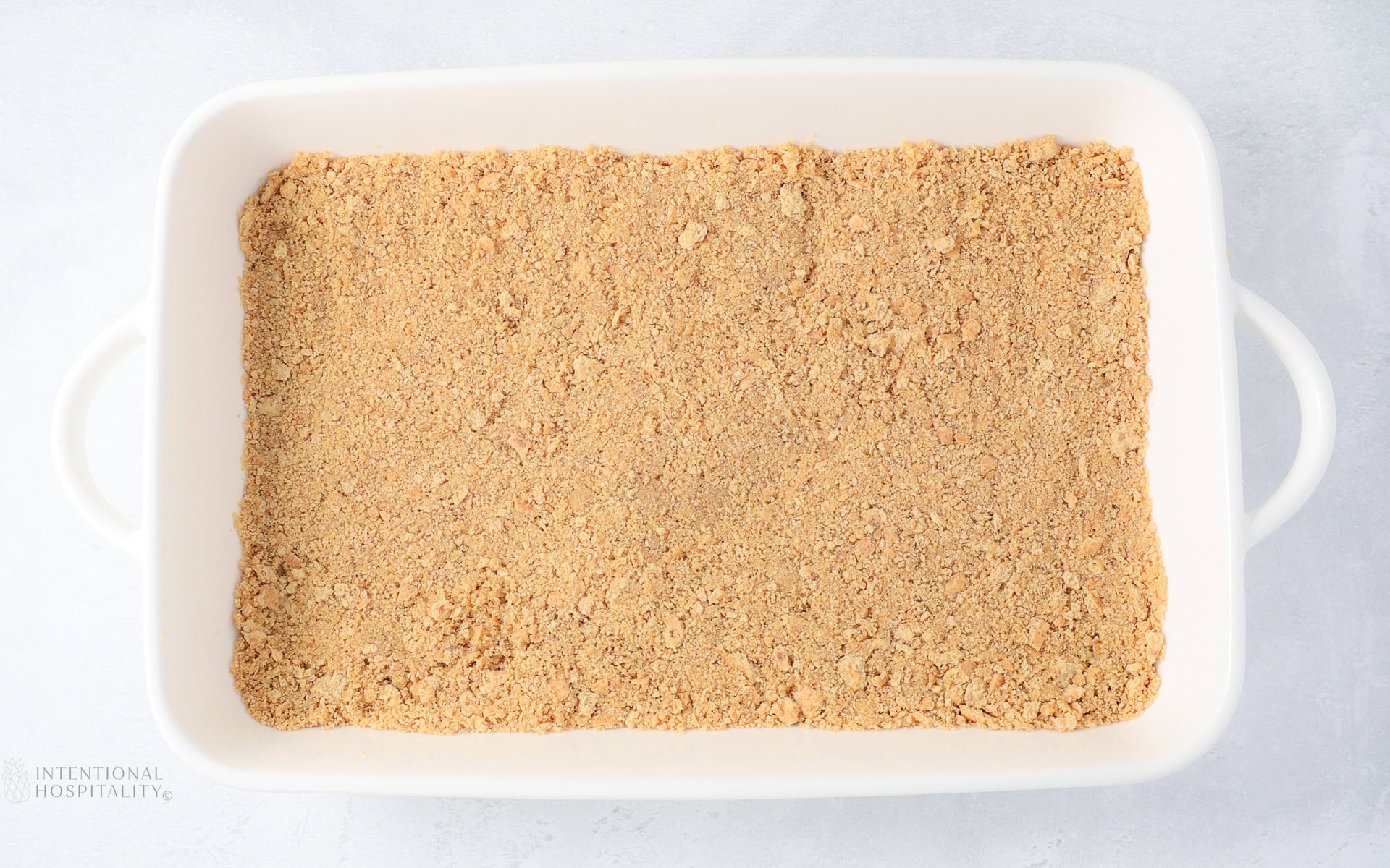 gram cracker crust in a 9x13