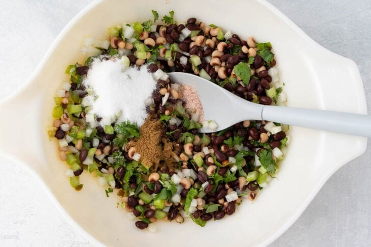 adding seasoning to mexican caviar