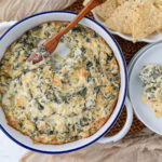 spinach artichoke dip hot and bubbly ready to serve.