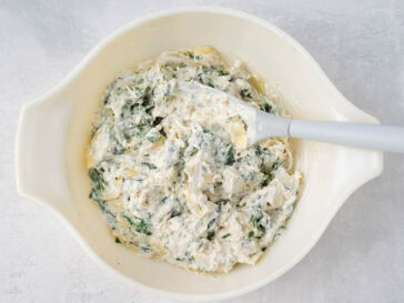 spinach artichoke dip mixed in bowl