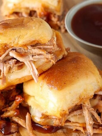 Pork sliders on Hawaiian buns with extra barbecue sauce and melted cheese