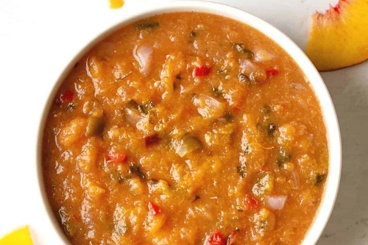 Peach bbq sauce in a bowl on the table.