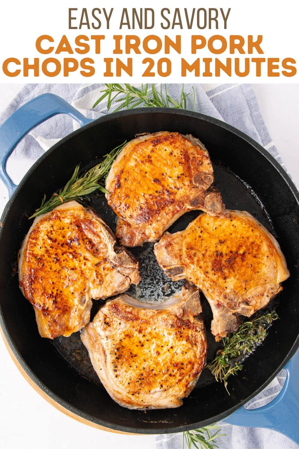 Four cooked pork chops in a black cast iron skillet, garnished with rosemary. The pan sits on a white surface with a blue towel. Text above reads, "Easy and Savory Cast Iron Pork Chops in 20 Minutes.