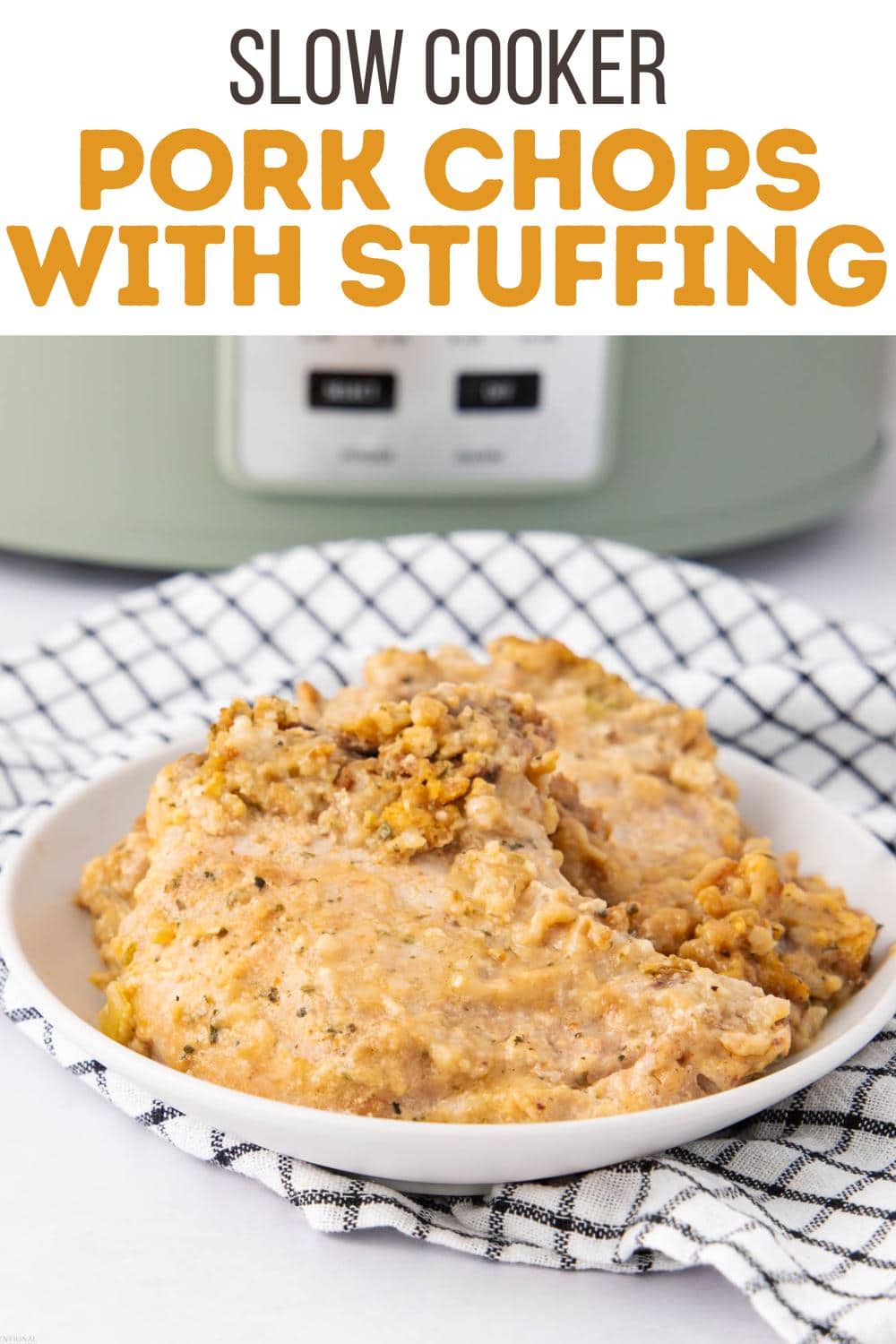 Plate with two pork chops topped with stuffing, set on a checkered cloth, in front of a slow cooker. The text above reads, "Slow Cooker Pork Chops with Stuffing.