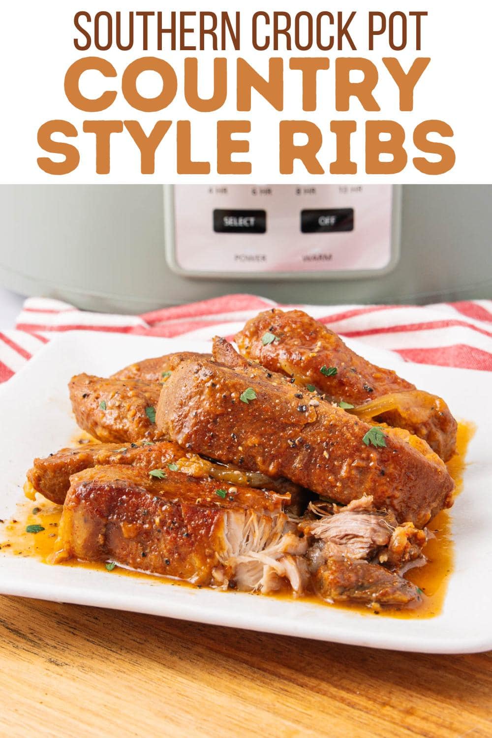 A white plate with several saucy, tender country style ribs garnished with herbs sits in front of a slow cooker. A red and white striped towel is next to the plate. Text above reads "Southern Crock Pot Country Style Ribs.