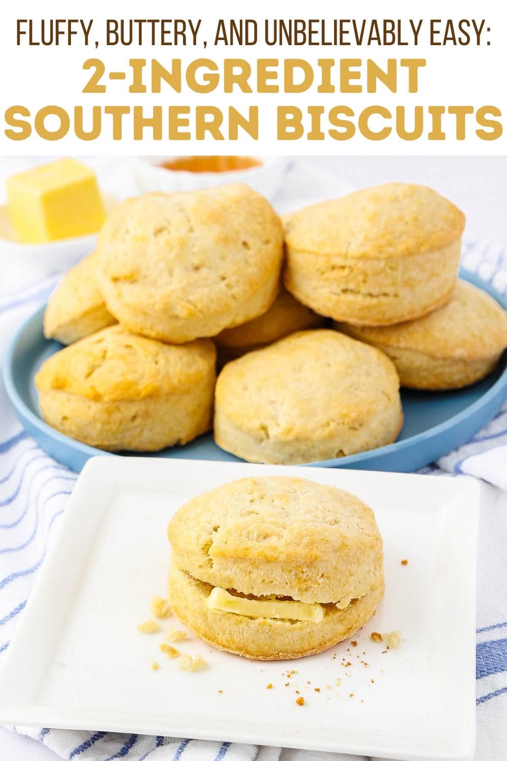 A plate of golden, fluffy biscuits sits on a blue dish, with one biscuit cut open and buttered on a white plate in front. The text above reads: “Fluffy, Buttery, and Unbelievably Easy: 2-Ingredient Southern Biscuits.”.