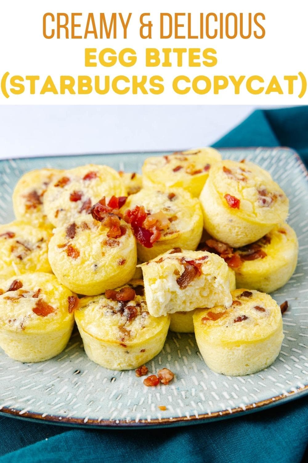 A plate of creamy egg bites topped with bacon bits, resembling Starbucks egg bites, displayed on a blue-green plate with a text overlay describing them as a copycat recipe.